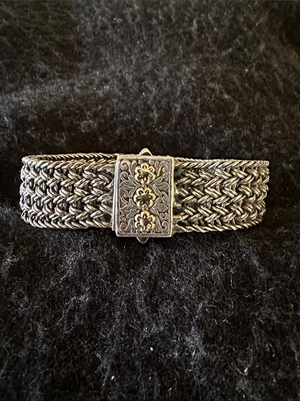 Sterling Silver cable rope bracelet with beautiful gold tone flower clasp..